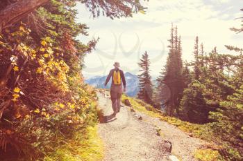 Hiking man in mountains in colorful Autumn season.