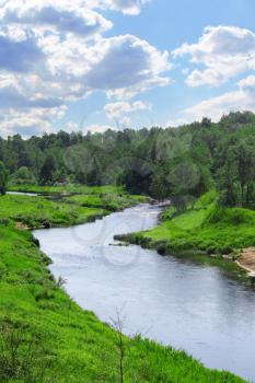 Beautiful landscape with river and blue cloudy sky