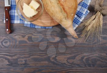 Food background top view with wheaten baked bread and butter