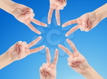 Royalty Free Photo of Hands Forming a Star