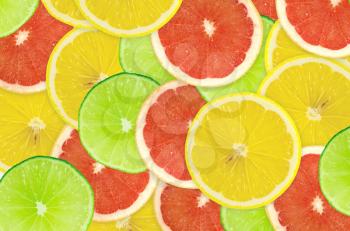 Abstract background of citrus slices. Closeup. Studio photography.