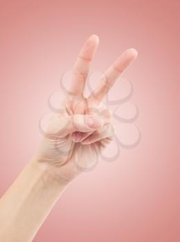 Hand with two fingers up in the peace or victory symbol. Also the sign for the letter V in sign language.