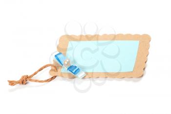 Blank tag tied with brown string. Price tag, gift tag, sale tag, address label, etc.