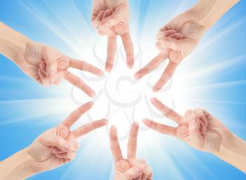 Hands of teamwork , forming the star shape