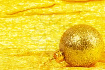 Christmas ball on golden background