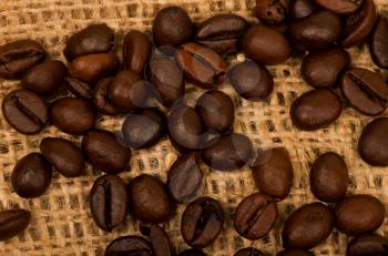 Coffee grains background on burlap