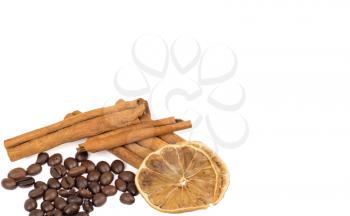 coffee beans, cinnamon and lemon isolated on white