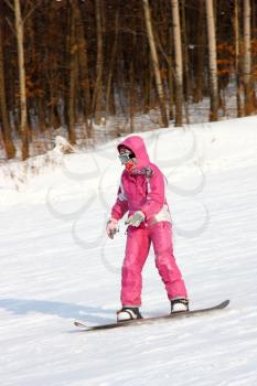  attractive young woman skiing quickly goes from mountain in winter equipment