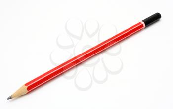 The read ground pencil lies is isolated on a snow-white background