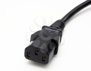 Black molded plastic or rubber power cord Know in UK as a Kettle Lead isolated against white background.