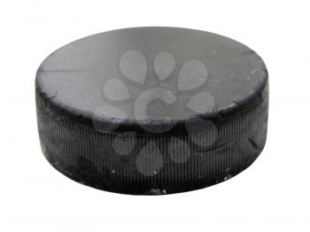 Black old hockey puck isolated on white background