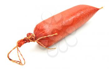 Tasty sausage is curtailed by a ring lies on a white background
