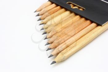 Wooden color pencils isolated on a white background