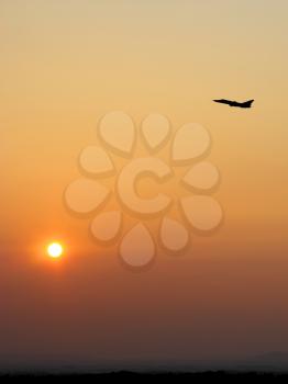 Aircraft takeoff at sunset