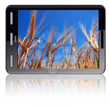Vertical Tablet computer isolated on the white background. Screen saver and ears of wheat.