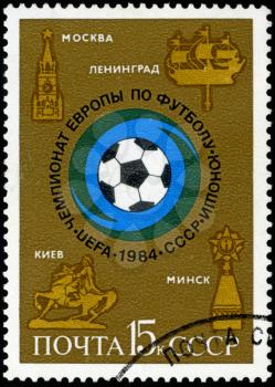 USSR - CIRCA 1984: A stamp printed in USSR (Russia) shows Soccer ball and emblems of cities with the inscription and name of series European Youth Soccer Championship , 1984, circa 1984