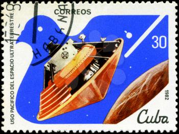 CUBA - CIRCA 1982: A stamp printed in CUBA, satellite, space station, peaceful use of outer space, circa 1982