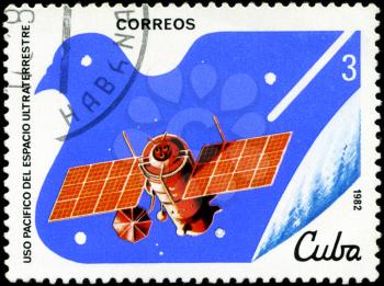 CUBA - CIRCA 1982: A stamp printed in CUBA, satellite, space station, peaceful use of outer space, circa 1982