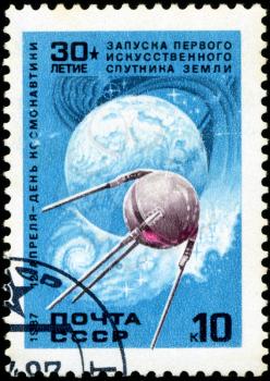 USSR - CIRCA 1987: A stamp printed in USSR , shows launching first satellite of earth, April 12 Day of Cosmonautics , circa 1987