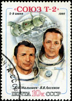 USSR - CIRCA 1980: A stamp printed in the USSR shows Soviet cosmonauts Malyshev and Aksenov and spacecraft Soyuz T-2, circa 1980. Big space series