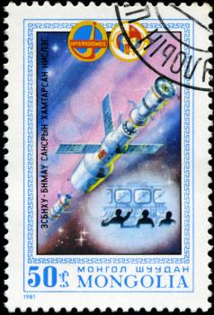 MONGOLIA- CIRCA 1981: A stamp printed in Mongolia shows spacestation Salut, stamp from series honoring Intercocmos program, circa 1981.