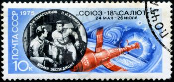USSR - CIRCA 1975: A stamp printed in USSR shows image of the Salyut 4 space station and Soviet cosmonauts Pyotr Ilyich Klimuk (1942) and Vitaly Ivanovich Sevastyanov (1935-2010), circa 1975.