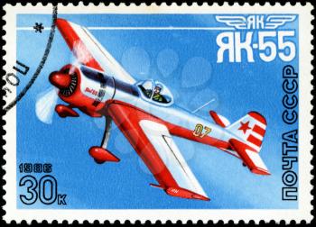 USSR - CIRCA 1986: A stamp printed in USSR shows the Aviation Emblem Yak and aircraft with the inscription Yak-55, 1981 , circa 1986