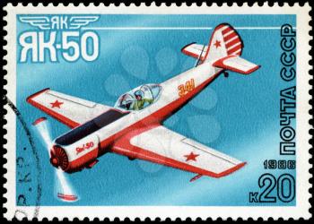 USSR - CIRCA 1986: A stamp printed in USSR shows the Aviation Emblem Yak and aircraft with the inscription Jak-50, 1981 , circa 1986