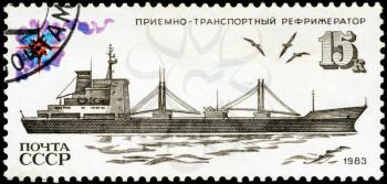 USSR - CIRCA 1983: Soviet postage stamp devoted to the Soviet fishing fleet, showing the receiving and transport refrigerator, circa 1983