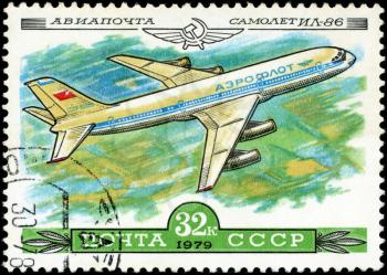USSR - CIRCA 1979: A Stamp printed in USSR shows the Aeroflot Emblem and aircraft with the inscription Airmail, Aircraft Il-86, from the series History of the Soviet aircraft industry, circa 1979