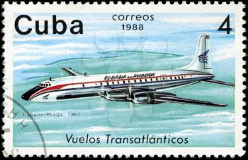 CUBA - CIRCA 1988: A Stamp printed in CUBA shows image of the airplane in transatlantic flight, Habana - Praga in 1961, circa 1988
