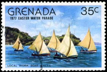 GRENADA - CIRCA 1977: A stamp printed in Grenada issued for the easter water parade  shows local work boat races, circa 1977.