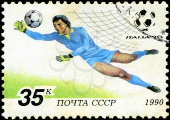 USSR - CIRCA 1990: a stamp printed by USSR shows football players. World football cup in Italy, series, circa 1990

