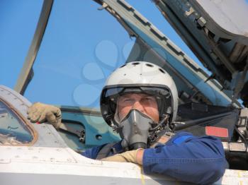 military pilot in a helmet on a aircraft
