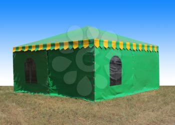 Green very big  tent in the field