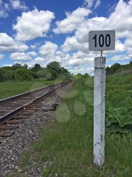 Mile post  railway with the number one hundred
