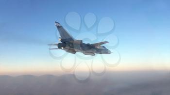 Military jet bomber Su-24 Fencer flying above the clouds.