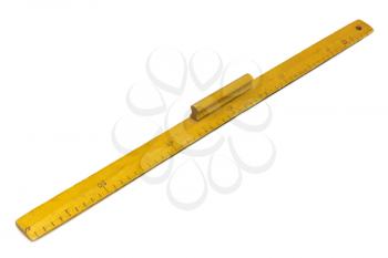 Yellow wooden measuring ruler on a white background.