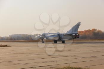 Military jet bomber Su-24 Fencer afterburner takeoff.