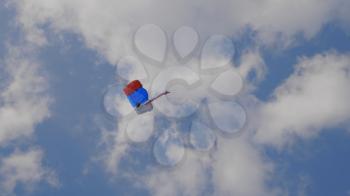MOSCOW - SEP 2: the paratrooper descends on a parachute with the flag of Russia at a celebration in honor of the 70th anniversary of the launch of the first aircraft An-2 on September 2, 2017 in Moscow, Russia.