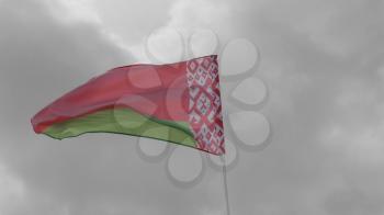 Belarus flag on the flagpole waving in the wind against a blue sky with clouds. Slow motion.