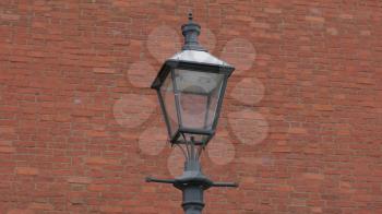 lantern on a background of ancient brick walls of the Kremlin.