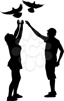Silhouette of a guy and a girl letting go of the dove into the sky.