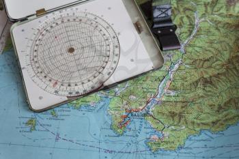 Map and navigational instruments for laying the way.