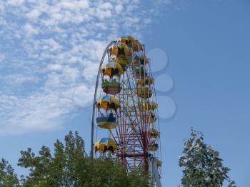 Atraktsion colorful ferris wheel against the sky.
