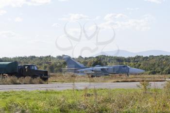 Military jet bomber Su-24 Fencer afterburner takeoff.