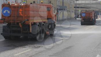 MOSCOW - JULE 25: n the city street works a watering machine on Jule 25, 2019 in Moscow, Russia.