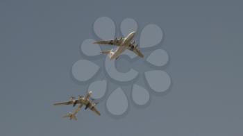 MOSCOW - MAY 7: bombers Tupolev Tu-160 and Tu-95 refueling in the air fly in sky on training parade in honor of Great Patriotic War victory on May 7, 2017 in Moscow, Russia.
