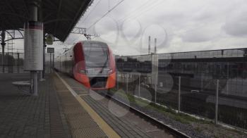MOSCOW, RUSSIA - JULY 13, 2018: Russian Railways high-speed train Lastochka (Swallow) rides along the railway path.