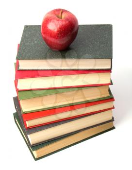 book stack with apple isolated on white background